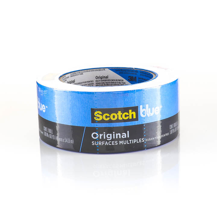 Roll of blue painter's tape on white background. 