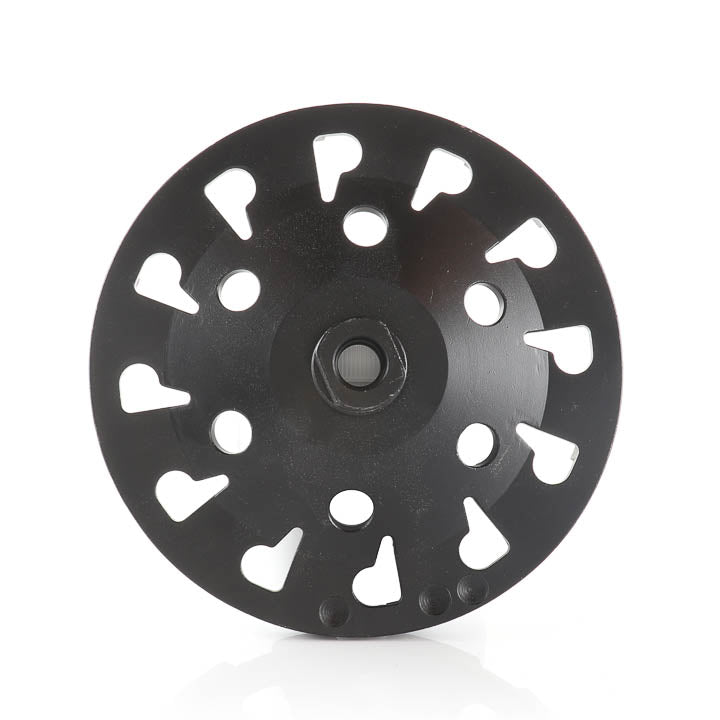 Front-facing view of a 7-inch black diamond turbo cup grinding wheel showing its circular pattern of cooling holes and segmented grinding rim.