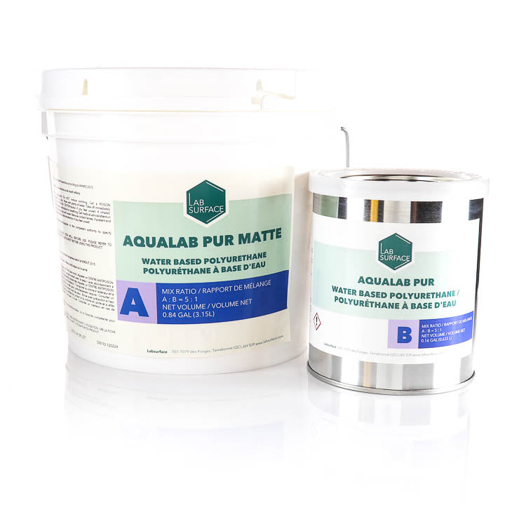 Two white plastic buckets of LAB SURFACE AQUALAB PUR MATTE water-based polyurethane on a white background, one larger bucket labeled with part A and one smaller canister labeled with part B.