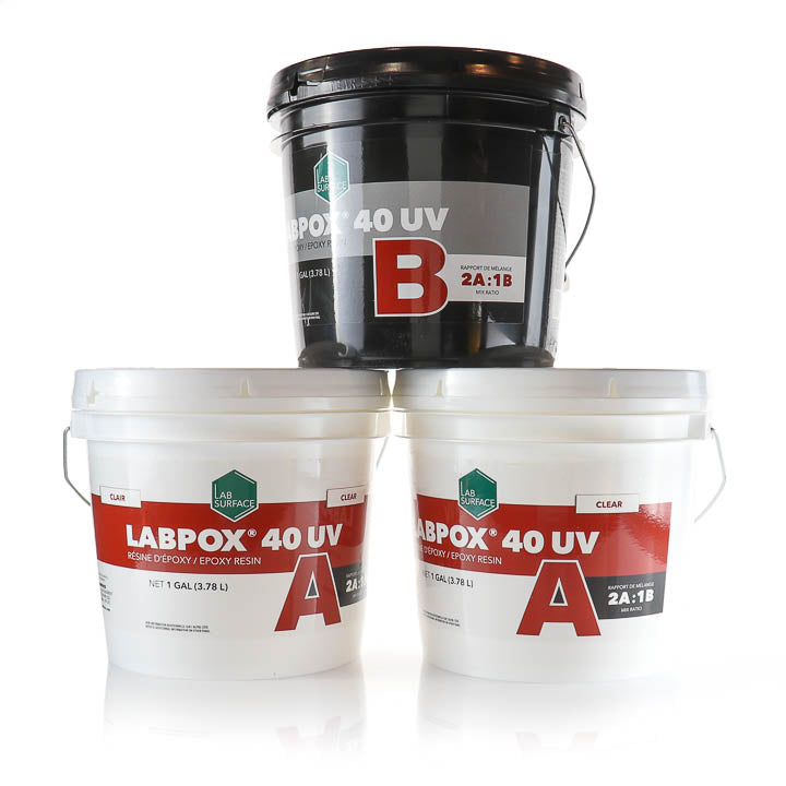 Three LABPOX 40 UV epoxy resin buckets arranged in a pyramid on a white background. The top bucket is black and labeled 'B', while the two buckets below are white and labeled 'A' and 'CLEAR'.
