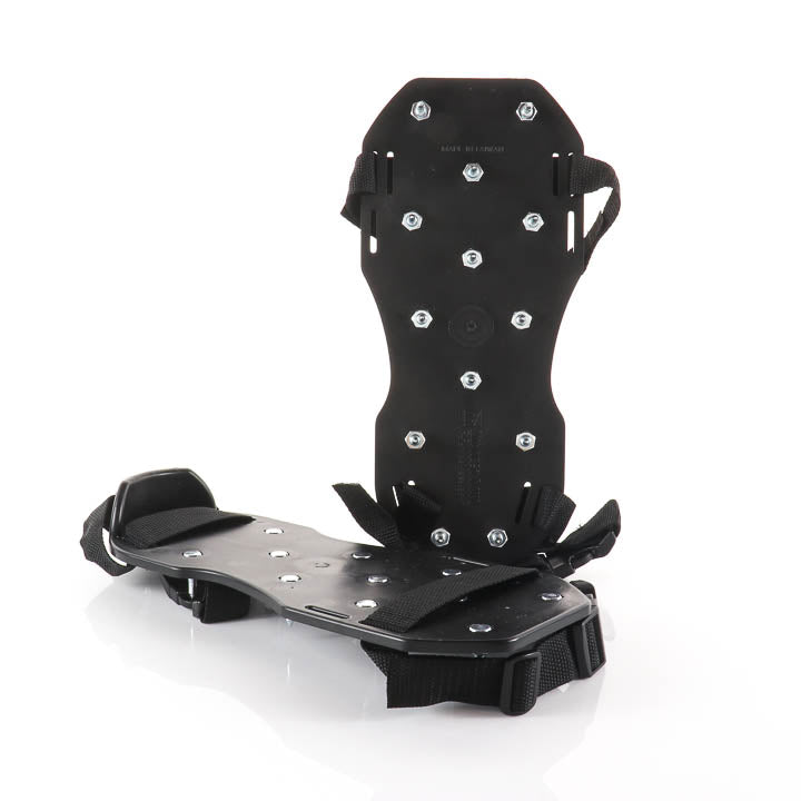 Industrial black polypropylene spiked shoes with heavy-duty nylon straps and adjustable buckles, designed with steel spikes on the soles for concrete overlay, self-leveling cement, and epoxy garage floor installations.