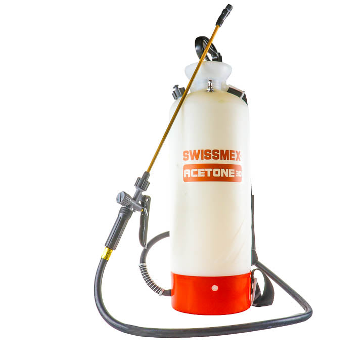 Swissmex Acetone-30 compression sprayer featuring a translucent 2.3-gallon HDPE tank, heavy-duty black chemical hose, professional brass wand with spray nozzle, and a bright orange bottom base.
