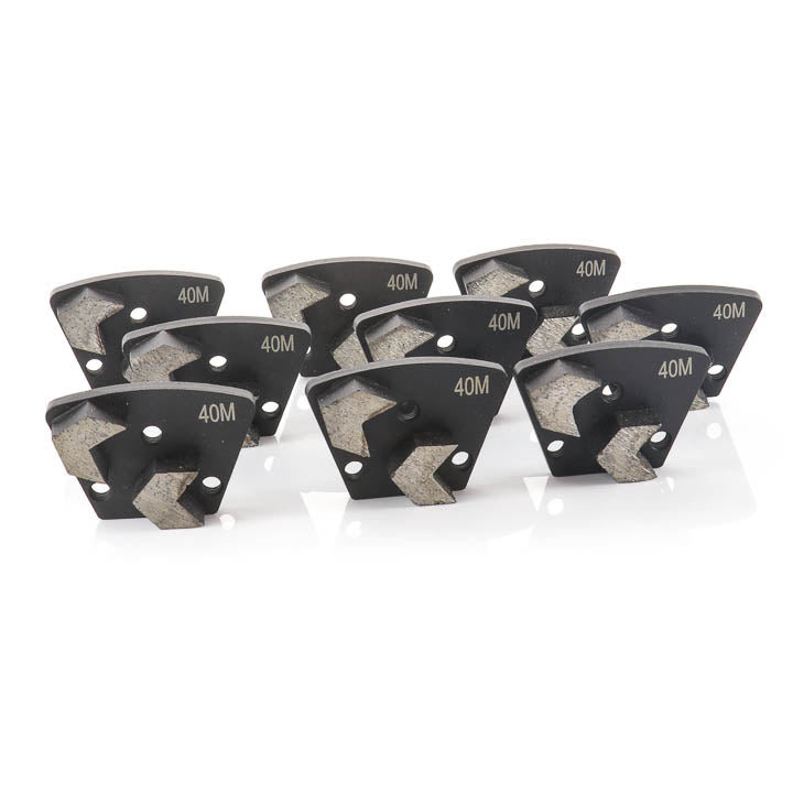 Nine black diamond cutting blades with gray abrasive segments and '40M' printed in gold, arranged on a reflective white surface.