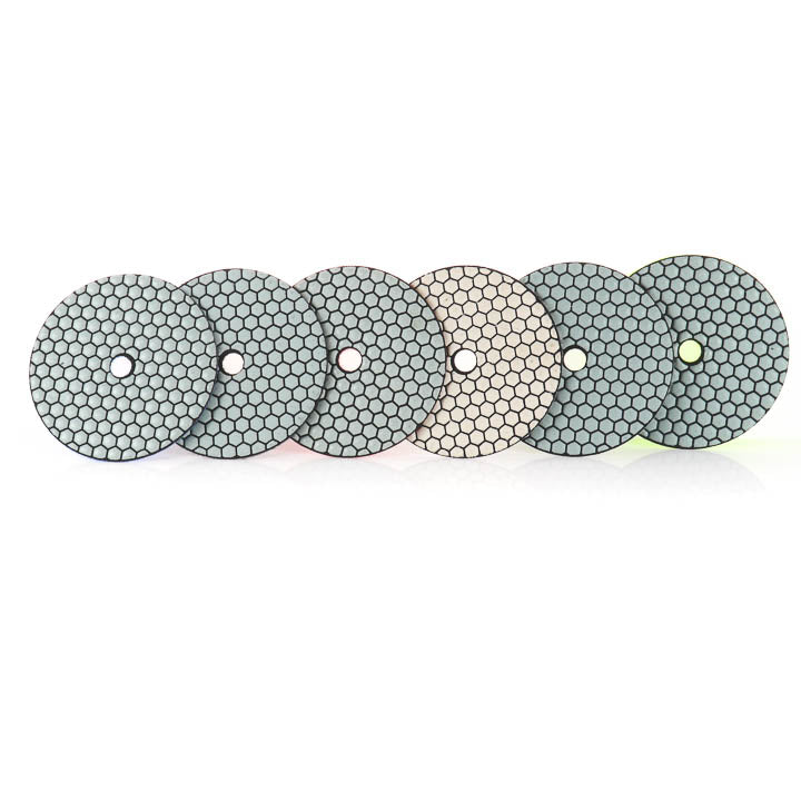 Back of Six of the SASE Resin Bond Diamond Pads, the white 800, Red 400, Blue 200m Black 100, Grey 50 and the yellow 30 Grit pads