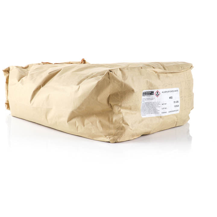 A 55 lb paper bag of #60 white aluminum oxide abrasive media from TSS Supply, showing the product label and safety hazard symbols on a clean white background.