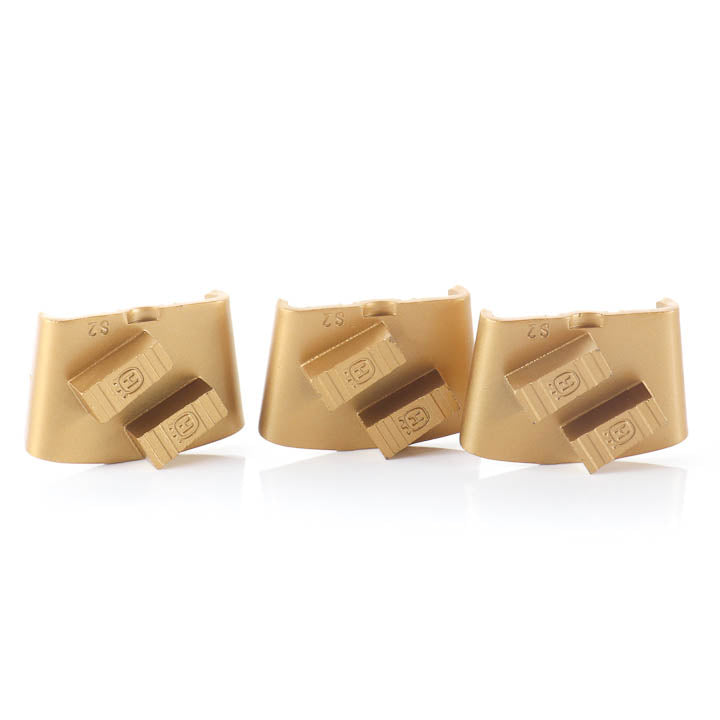 Set of three gold Husqvarna Elite Grind EZ 25 grit double-segment diamond grinding blocks.