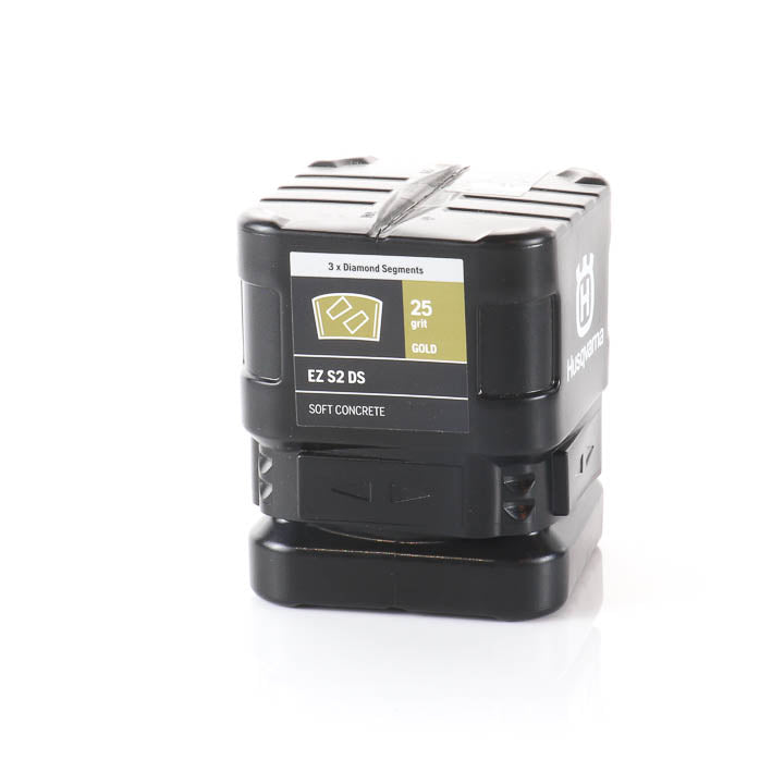 front view of a black Husqvarna EZ S2 DS 25 grit double-segment diamond grinding block for soft concrete in its original retail packaging label.