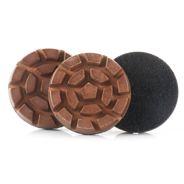Husqvarna Vari-Polish VP W 100 Grit 3-inch resin diamond polishing pucks showing the abrasive face and pattern