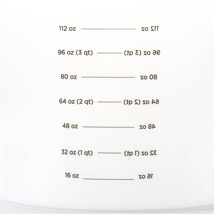 Close-up view of the interior measurement graduations inside the mixing pail for precise mixing ratios.