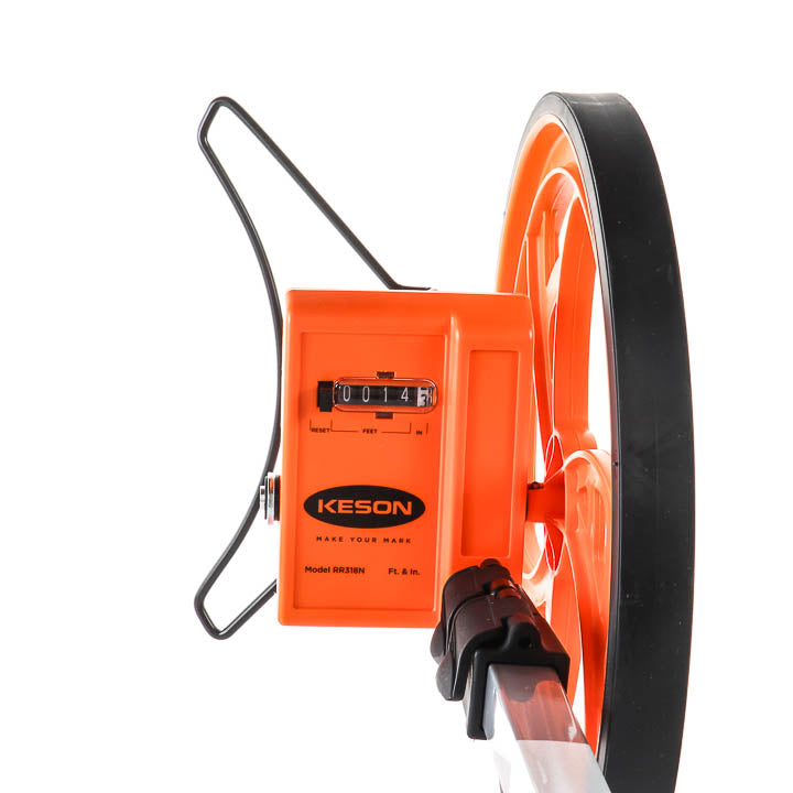 A close-up of a contractor-grade measuring wheel featuring an orange counter box displaying "0014" by Keson, an orange wheel with a black rubber tread, and a black metal frame against a clean white background.